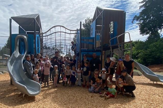 kids, parents and CVRD staff pictured in front of new Union Bay Playground
